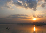 Lone Canoe at Sunrise on Lake Tana