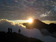 Trekkers Taking in the Sunset from the Crater Rim