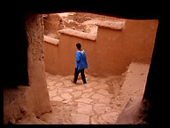 Boy in Narrow Alleyway