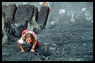 Climbing the Steep Steps of the Pyramid at Angkor Thom