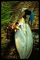 Mother and Son Cleaning a Boat