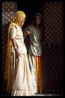 Women Standing in a Doorway