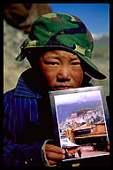 Young Boy with Postcard of the Potala Palace